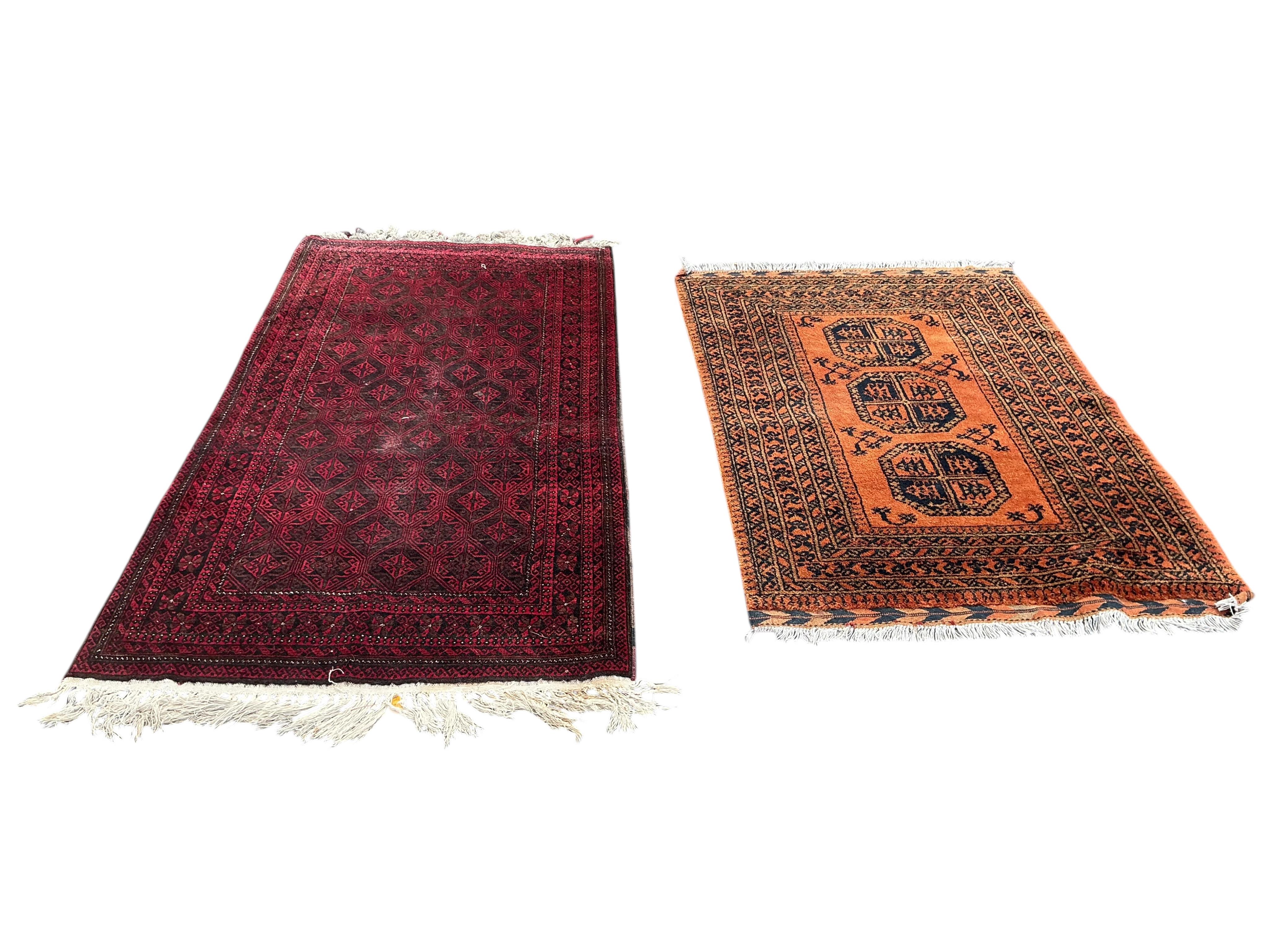 A Belouch red ground rug and an Afghan rug, 180 x 100cm and 155 x 105cm